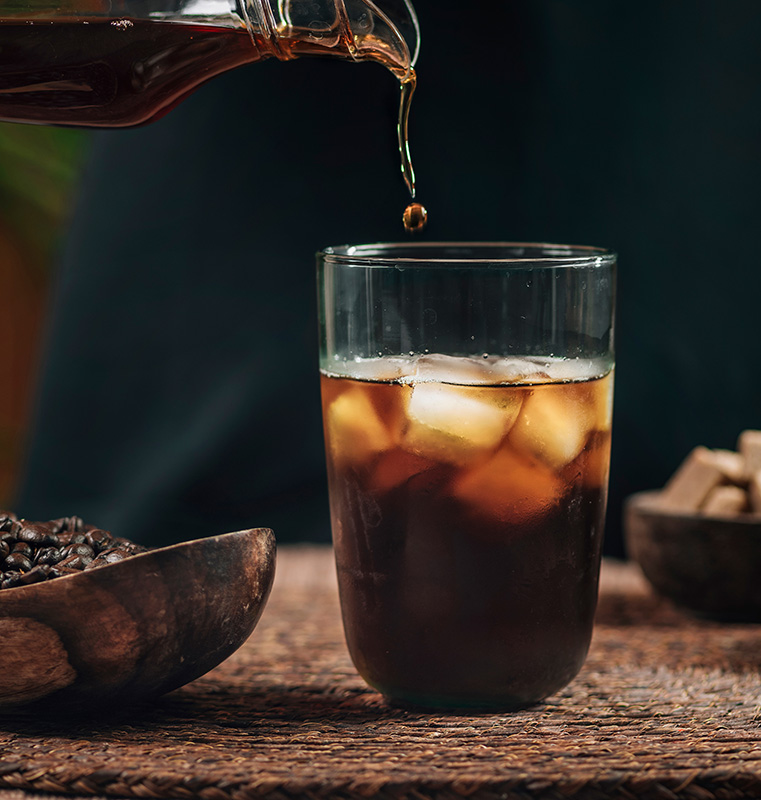 pouring iced cold brew coffee pouring iced cold brew coffee